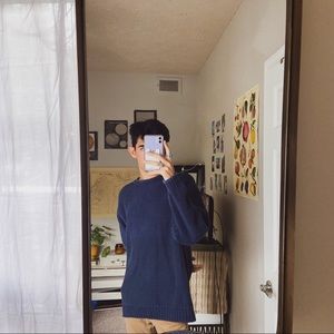 blue fisherman’s sweater